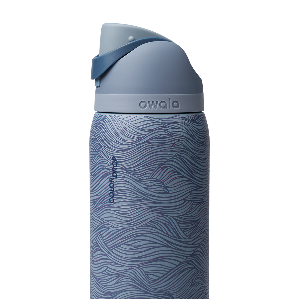 Owala FreeSip 32oz, slate blue body with embossed wave texture, matching slate blue lid and flip cap